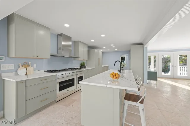 a view of kitchen with cabinets and stove