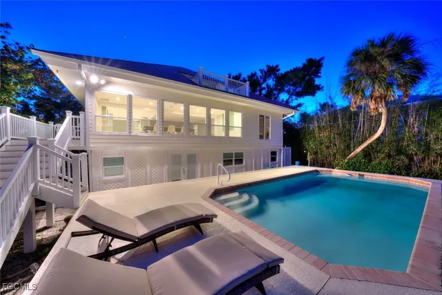 a view of a chairs and table in patio