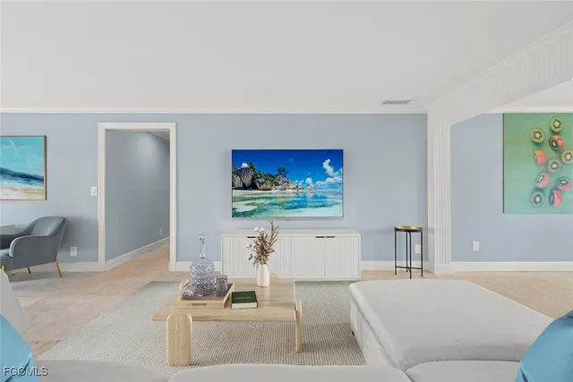 a living room with furniture and a flat screen tv