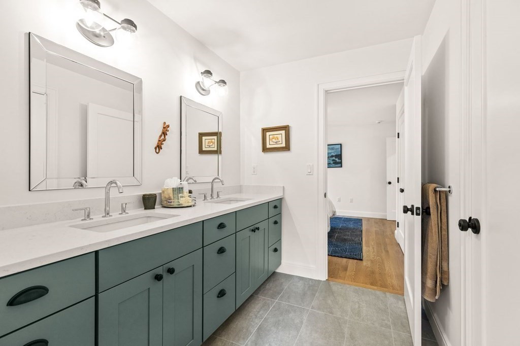 231 Marrett Road Lexington, MA 02421 - Photo 19 of 24 a spacious bathroom with a double vanity sink mirror and double