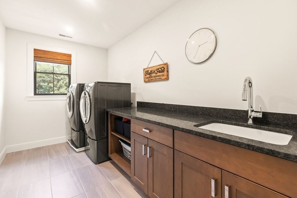 231 Marrett Road Lexington, MA 02421 - Photo 20 of 24 a kitchen with stainless steel appliances granite countertop a sink and a refrigerator