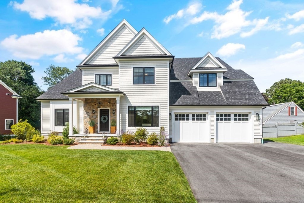 231 Marrett Road Lexington, MA 02421 - Photo 2 of 24 a front view of a house with a yard