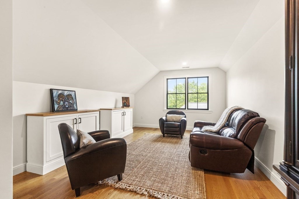 231 Marrett Road Lexington, MA 02421 - Photo 22 of 24 a living room with furniture and a window