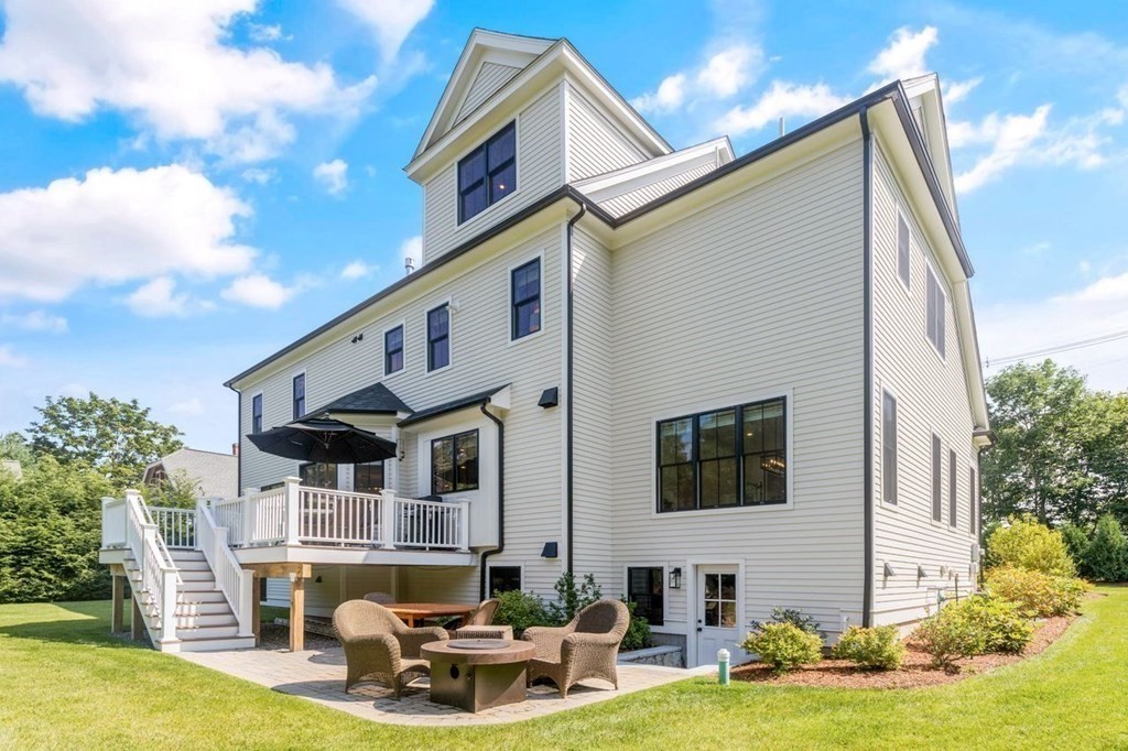 231 Marrett Road Lexington, MA 02421 - Photo 24 of 24 a front view of house with yard swimming pool and outdoor seating