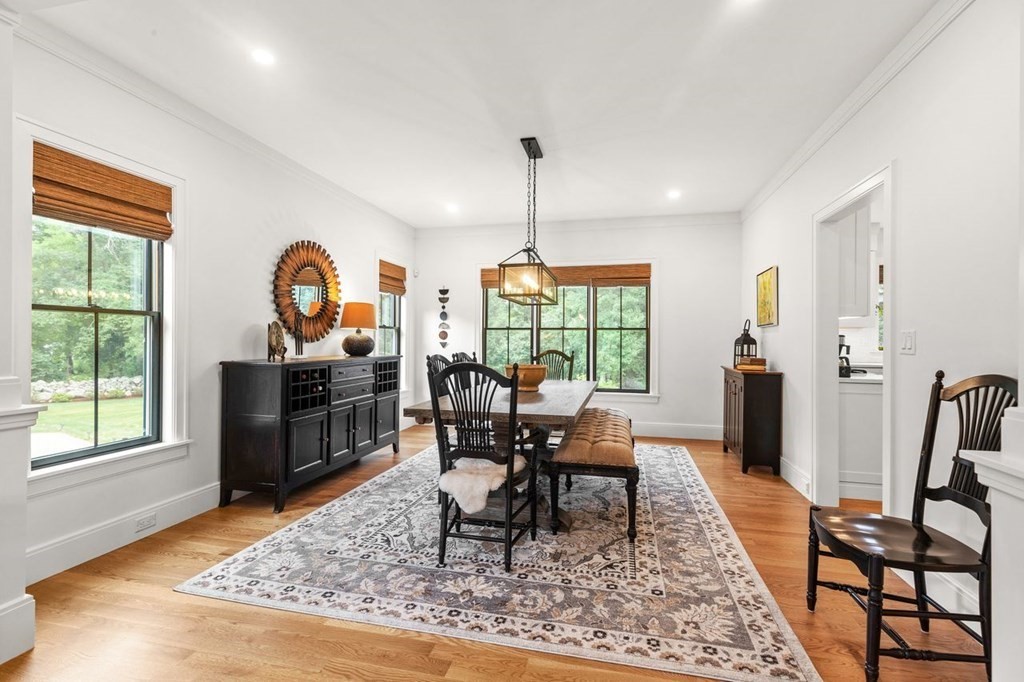 231 Marrett Road Lexington, MA 02421 - Photo 5 of 24 a living room with furniture a rug a fireplace and a window
