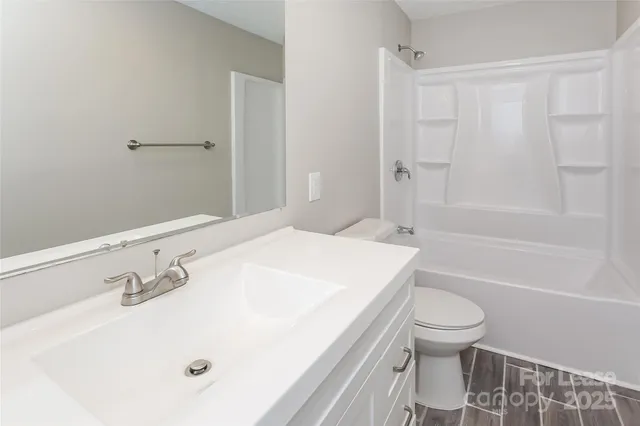 a bathroom with a sink a toilet and a bathtub