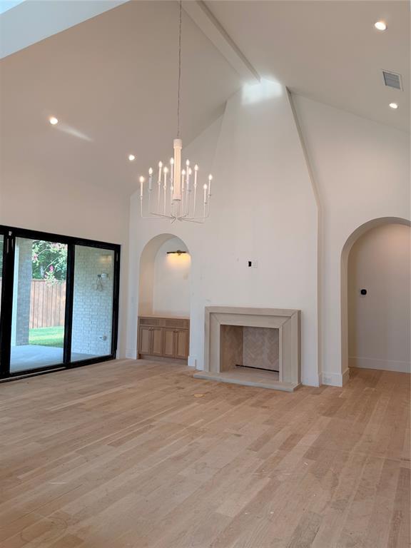 3830 Dunhaven Road Dallas, TX 75220 - Photo 4 of 30 Isokern fireplace with cast stone mantle. Vaulted ceilings.
