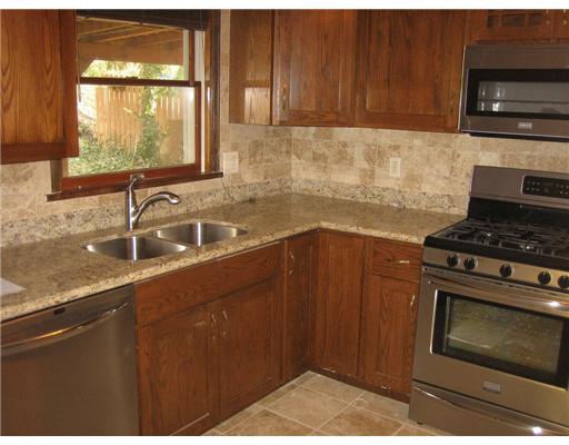 2017 Ridge Road McKeesport, PA 15135 - Photo 3 of 18 Kitchen. Stunning granite kitchen with new rich wood cabinetry ,including all new stainless appliances and new ceramic tile floors!