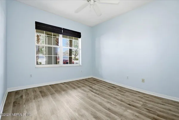 a view of empty room with windows