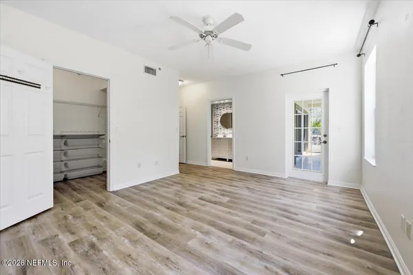 a view of an empty room with a window