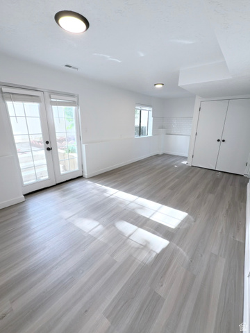 227 South West Lane Provo, UT 84601 - Photo 23 of 25 Spacious room featuring light wood-finish flooring, recessed lighting, and white walls