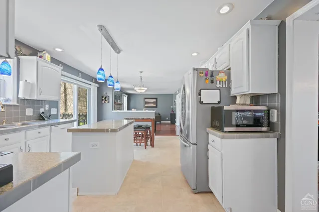 a living room with a couch and a fireplace