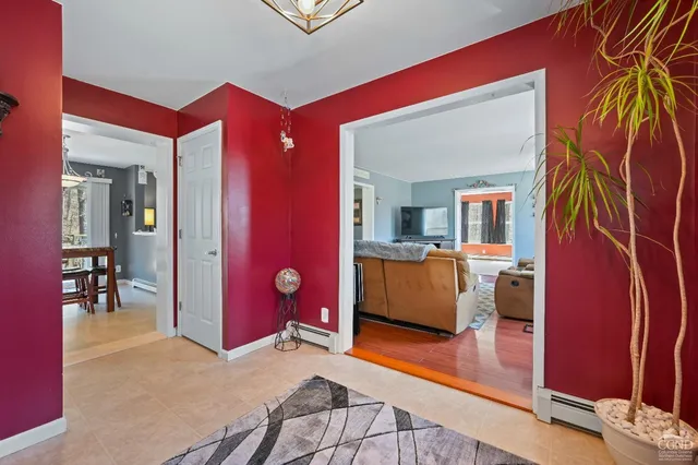 a view of a house with a yard chairs and table