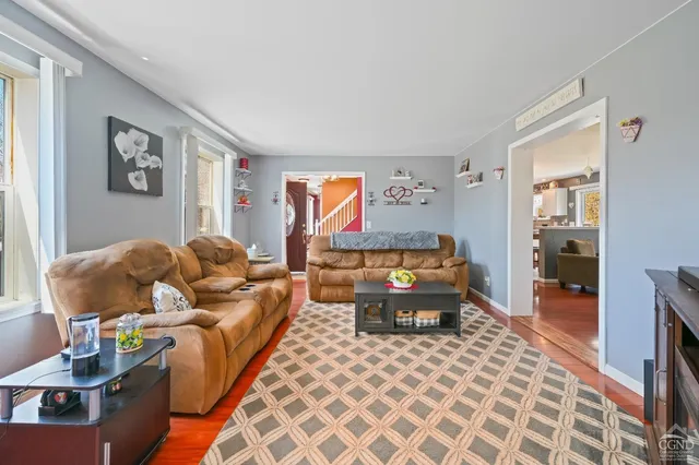 a view of a big yard with a house in the background