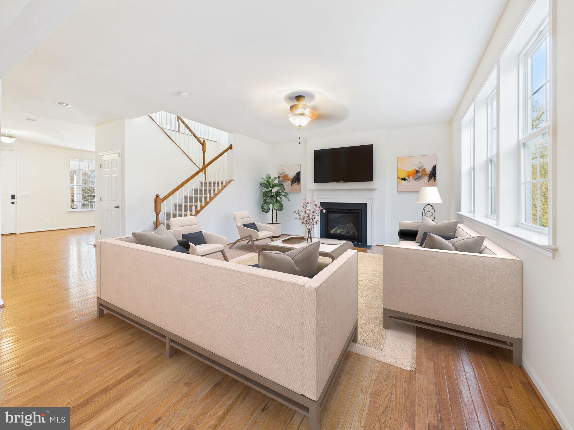 18213 Jillian Lane Triangle, VA 22172 - Photo 2 of 41 a living room with furniture and a flat screen tv