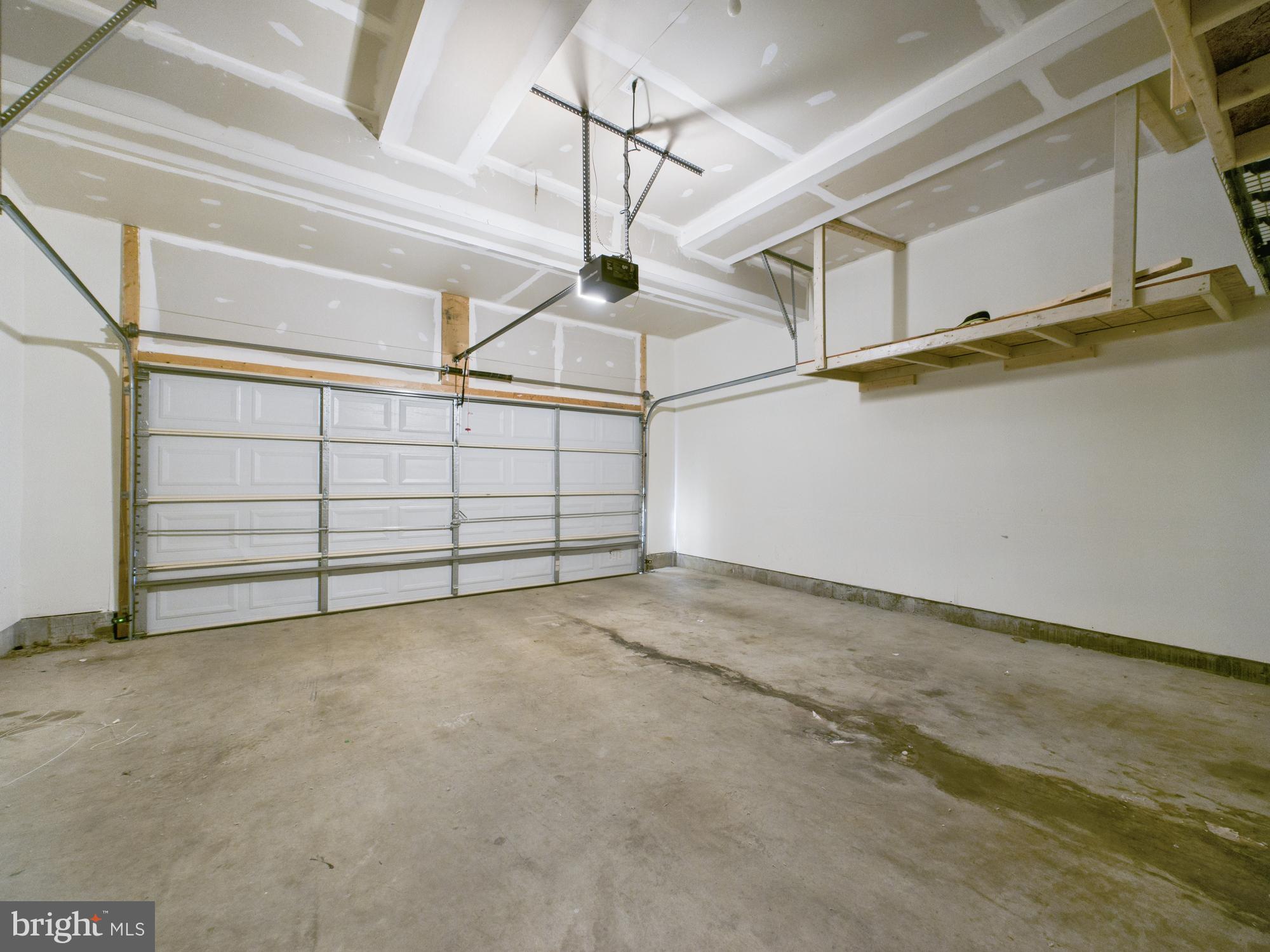 18213 Jillian Lane Triangle, VA 22172 - Photo 36 of 41 2 car Garage with storage shelves