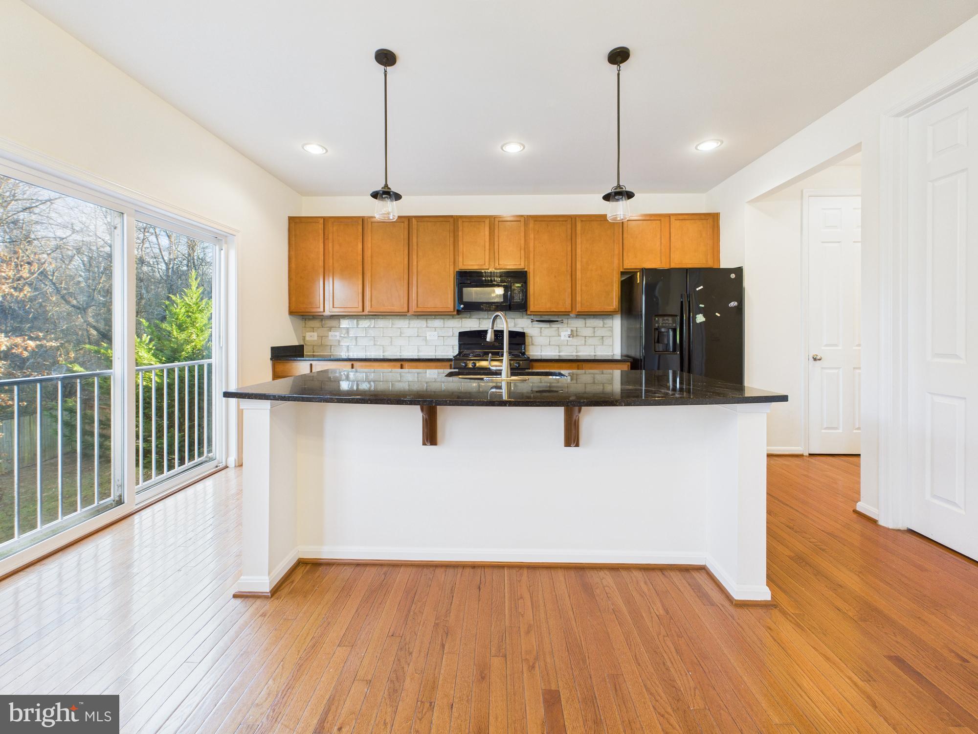 18213 Jillian Lane Triangle, VA 22172 - Photo 10 of 41 a view of kitchen with wooden floor and window