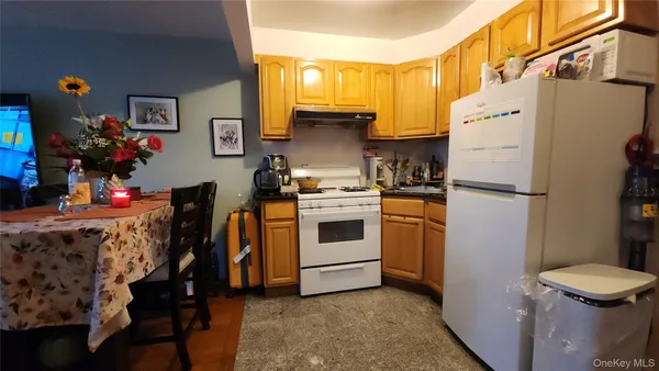 a kitchen with stainless steel appliances a refrigerator sink and cabinets