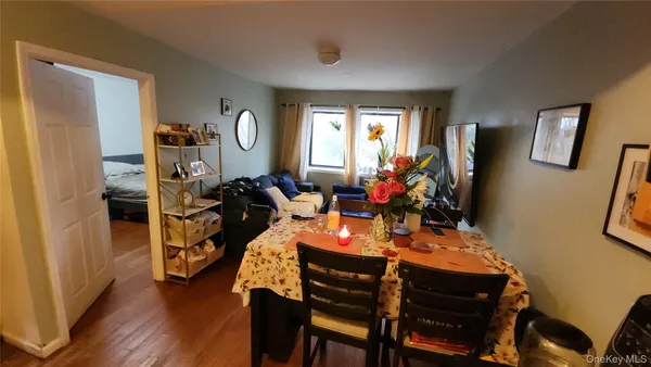 a view of a dining room with furniture window and wooden floor
