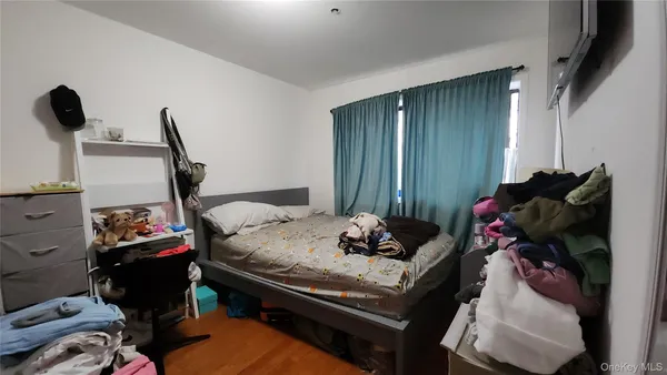 a bed room with furniture and a closet