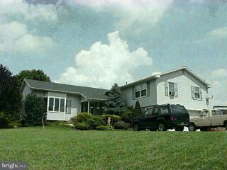 1522 A Lehman Road Spring Grove, PA 17362 - Photo 1 of 1 a front view of a house with a garden