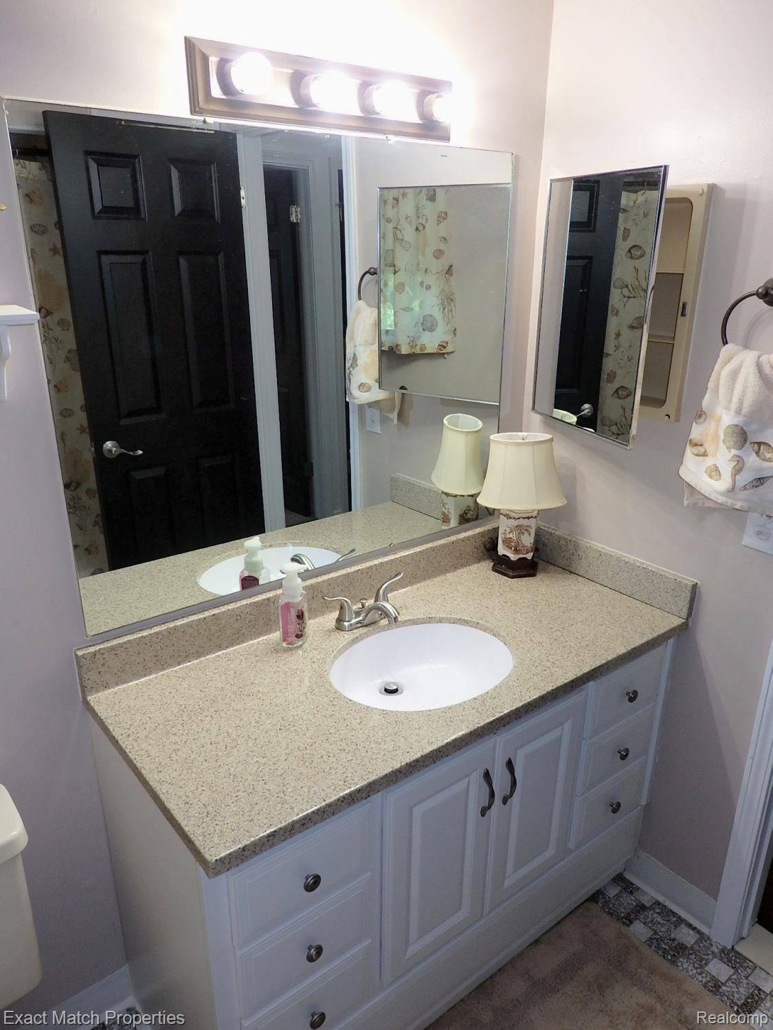 2980 East Rose Center Road Highland, MI 48356 - Photo 55 of 72 Updated vanity and fixtures