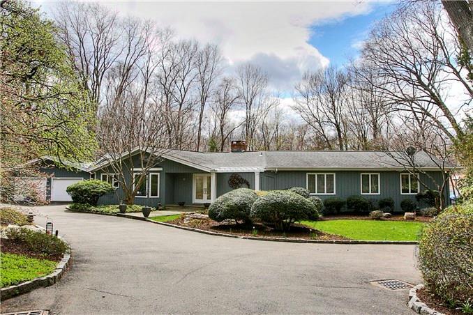 7 Fieldcrest Road Westport, CT 06880 - Photo 1 of 1 a front view of a house with a yard and outdoor seating