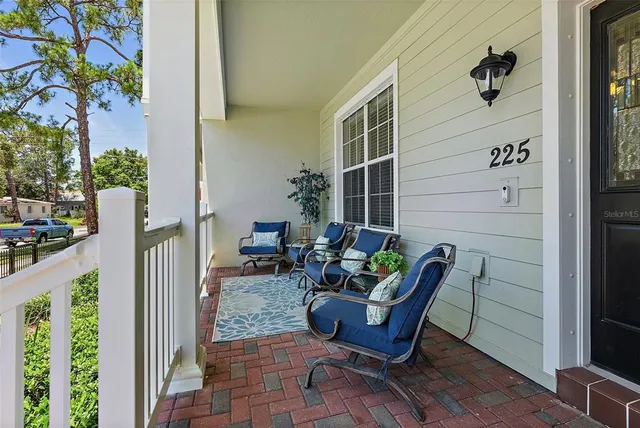 a view of a chairs in backyard of the house