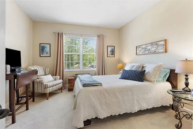 a bedroom with a bed and furniture