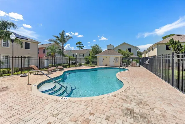 a view of a swimming pool with a lounge chairs
