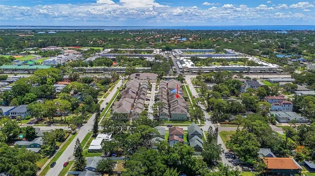 an aerial view of residential building and trees