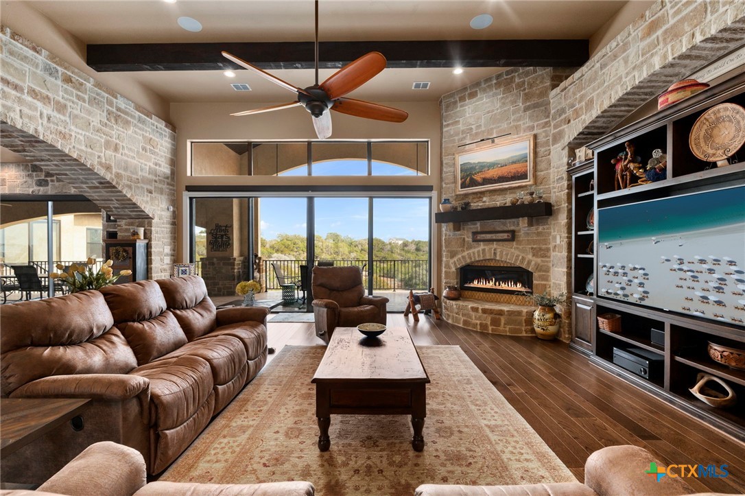 1039 Bluewater Place Spring Branch, TX 78070 - Photo 14 of 48 a living room with furniture fireplace and a fireplace