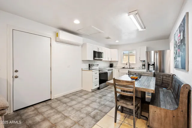 a view of a dining room kitchen and a window
