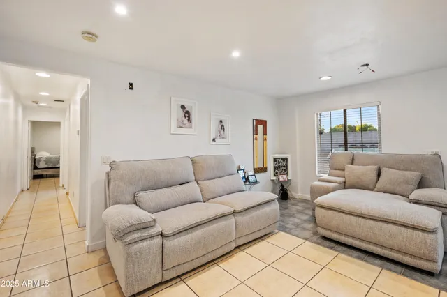 a living room with furniture and a couch