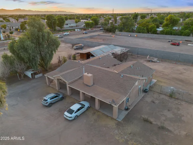 an aerial view of a house with pool