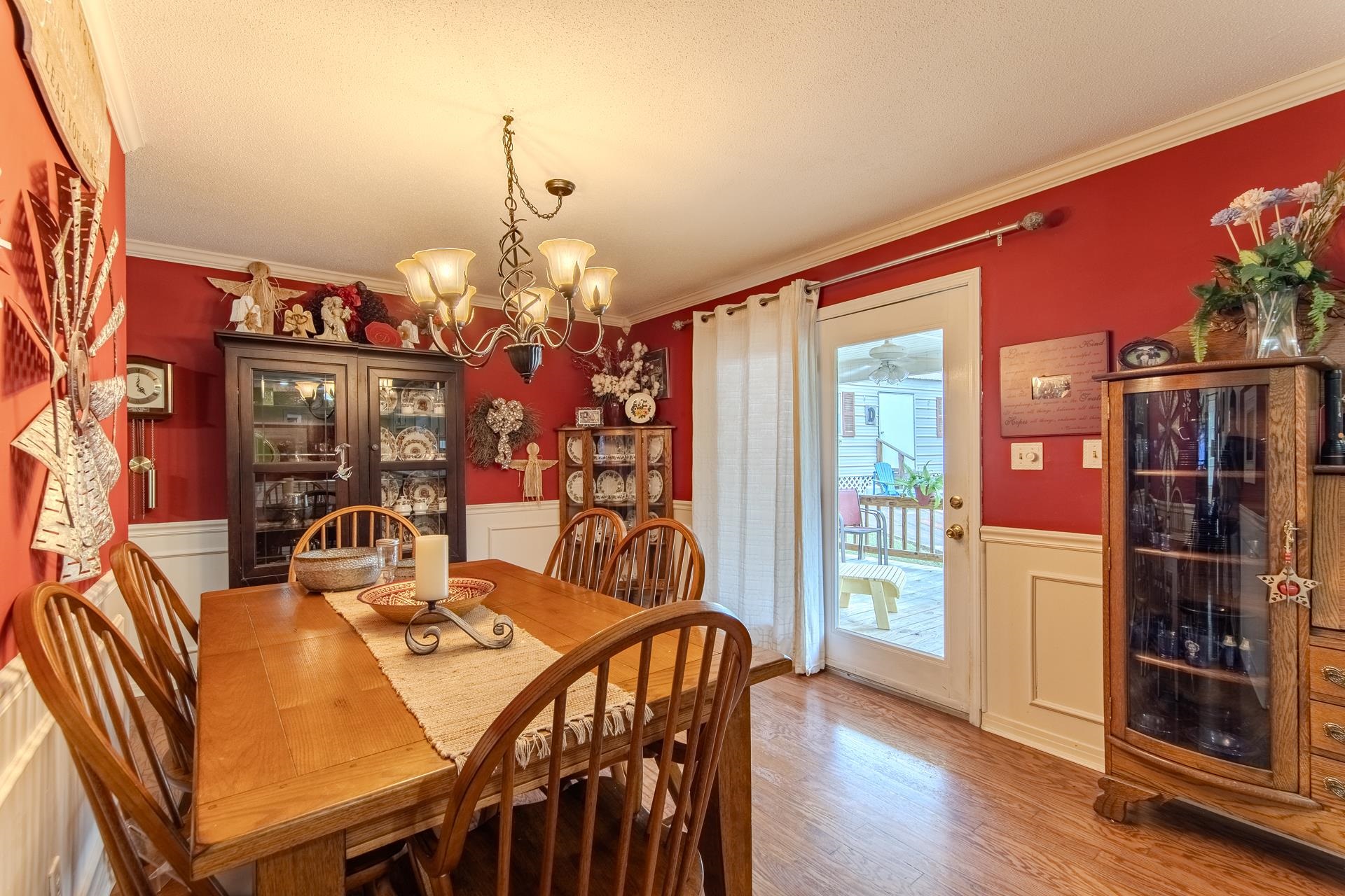313 Country Club Lane Selmer, TN 38375 - Photo 15 of 36 a view of a dining room with furniture and wooden floor