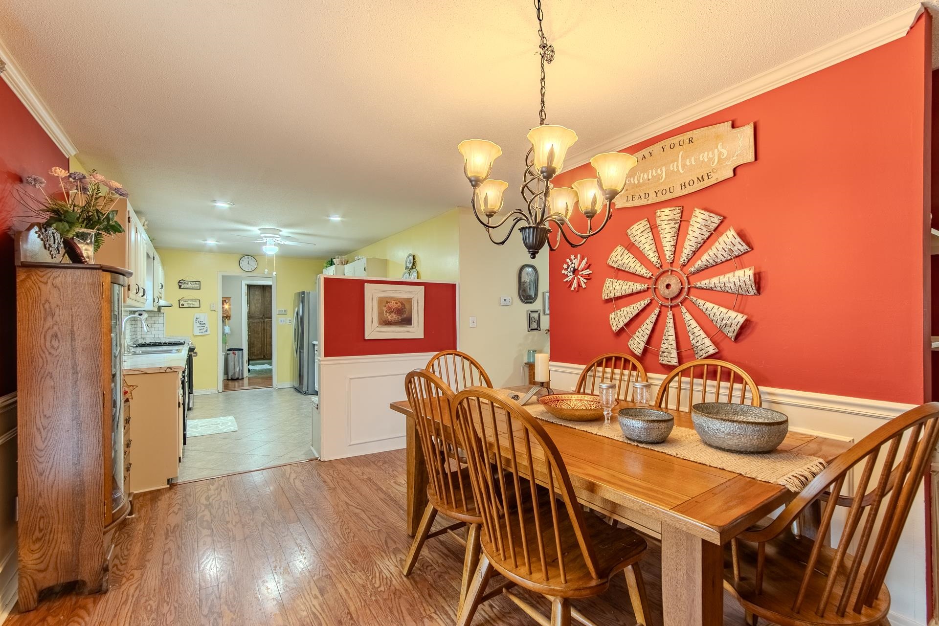 313 Country Club Lane Selmer, TN 38375 - Photo 16 of 36 a view of a dining room with furniture and wooden floor