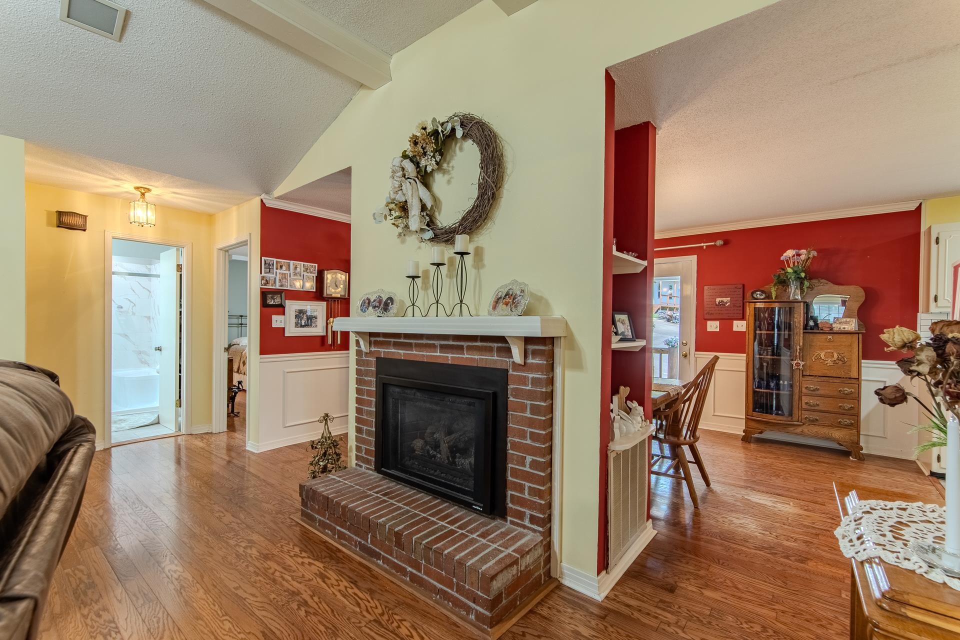 313 Country Club Lane Selmer, TN 38375 - Photo 17 of 36 a living room with furniture a rug and a fireplace