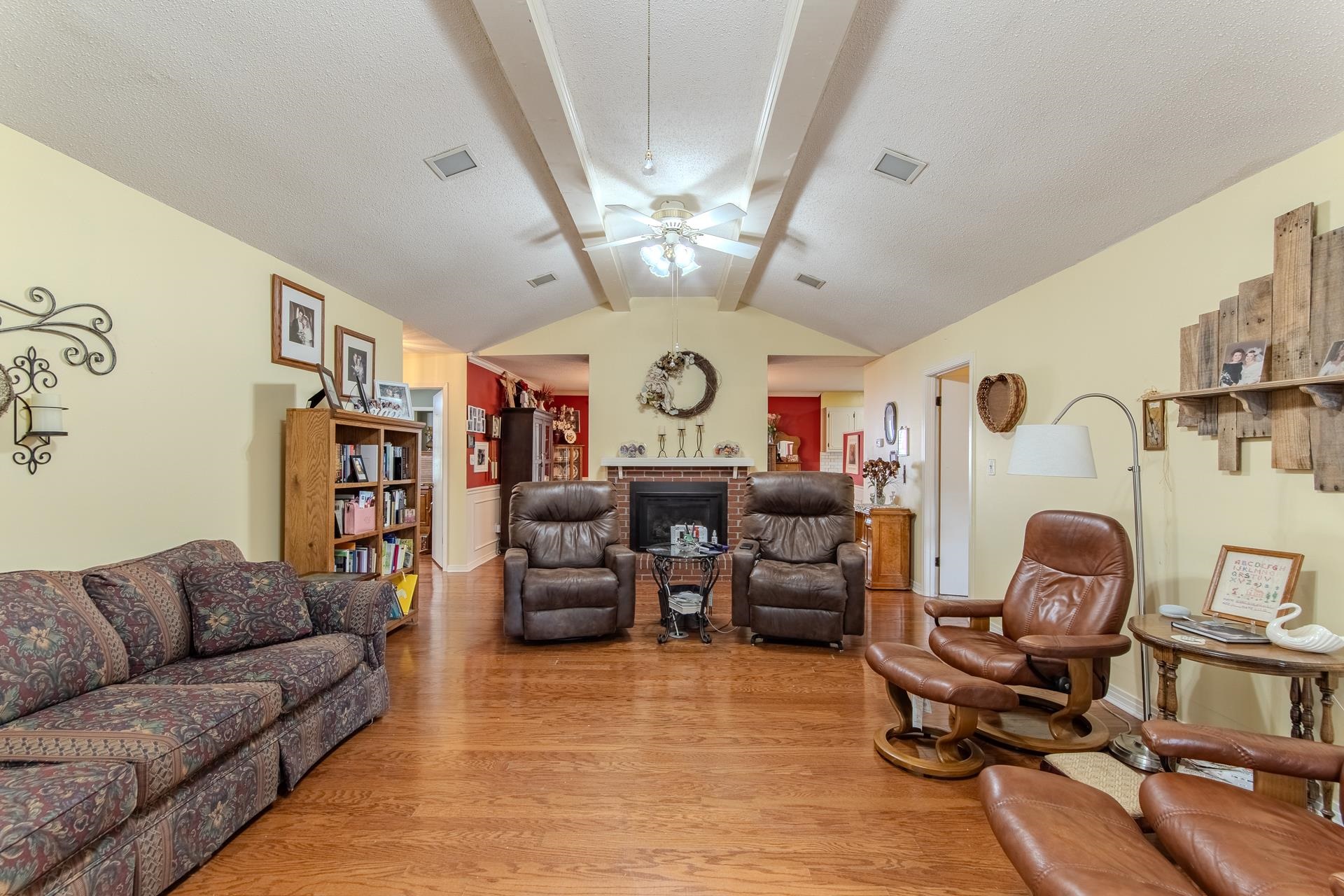313 Country Club Lane Selmer, TN 38375 - Photo 18 of 36 a living room with fireplace furniture and a chandelier