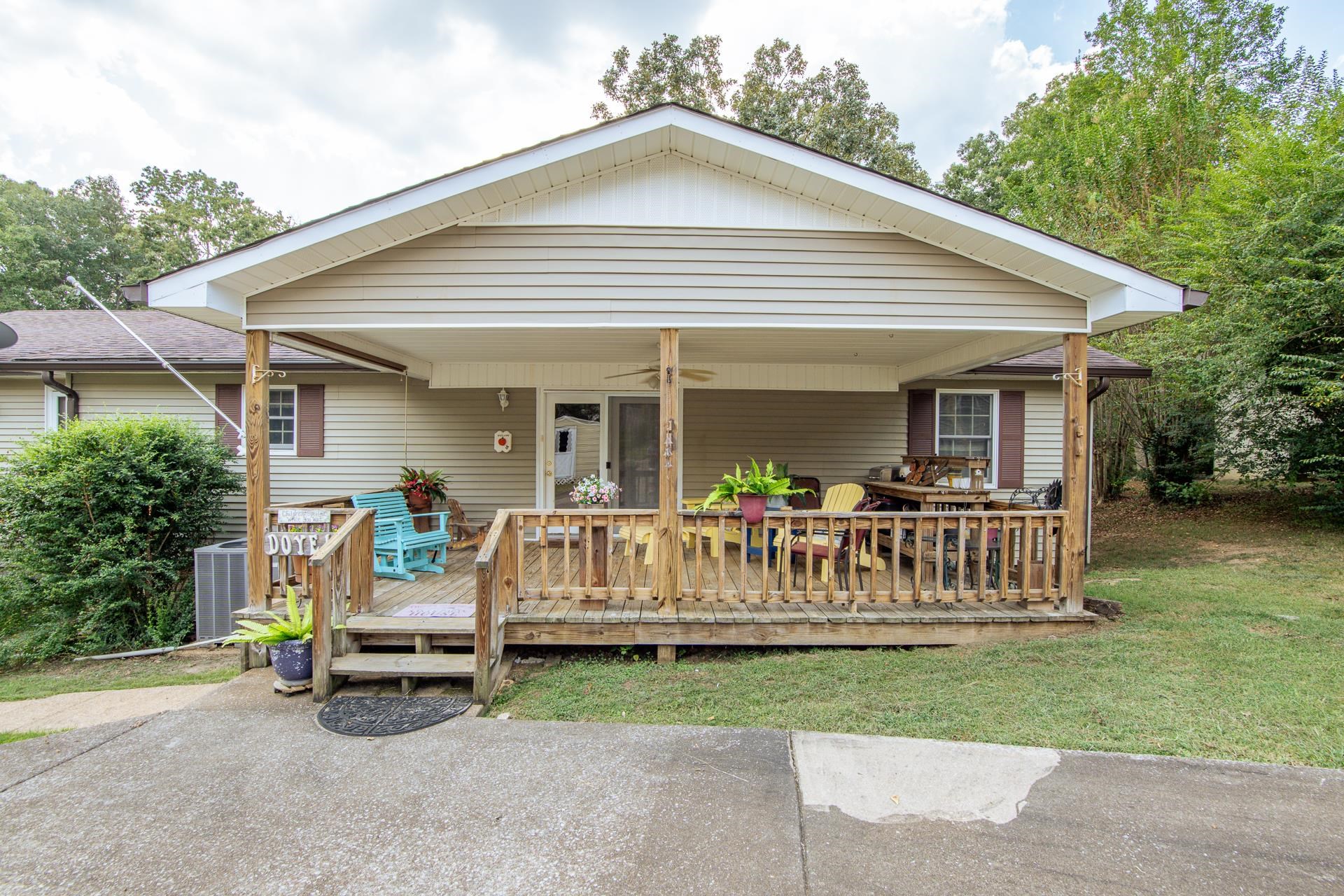 313 Country Club Lane Selmer, TN 38375 - Photo 19 of 36 a view of a house with a yard and deck area next to a yard