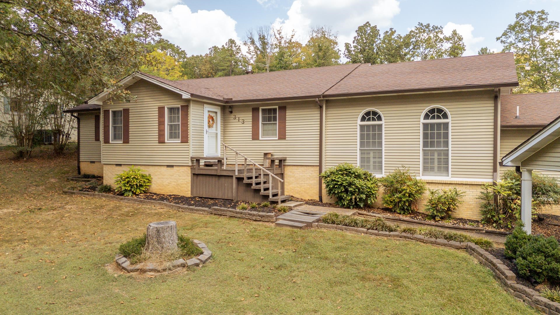 313 Country Club Lane Selmer, TN 38375 - Photo 2 of 36 a view of a house with chair and tables