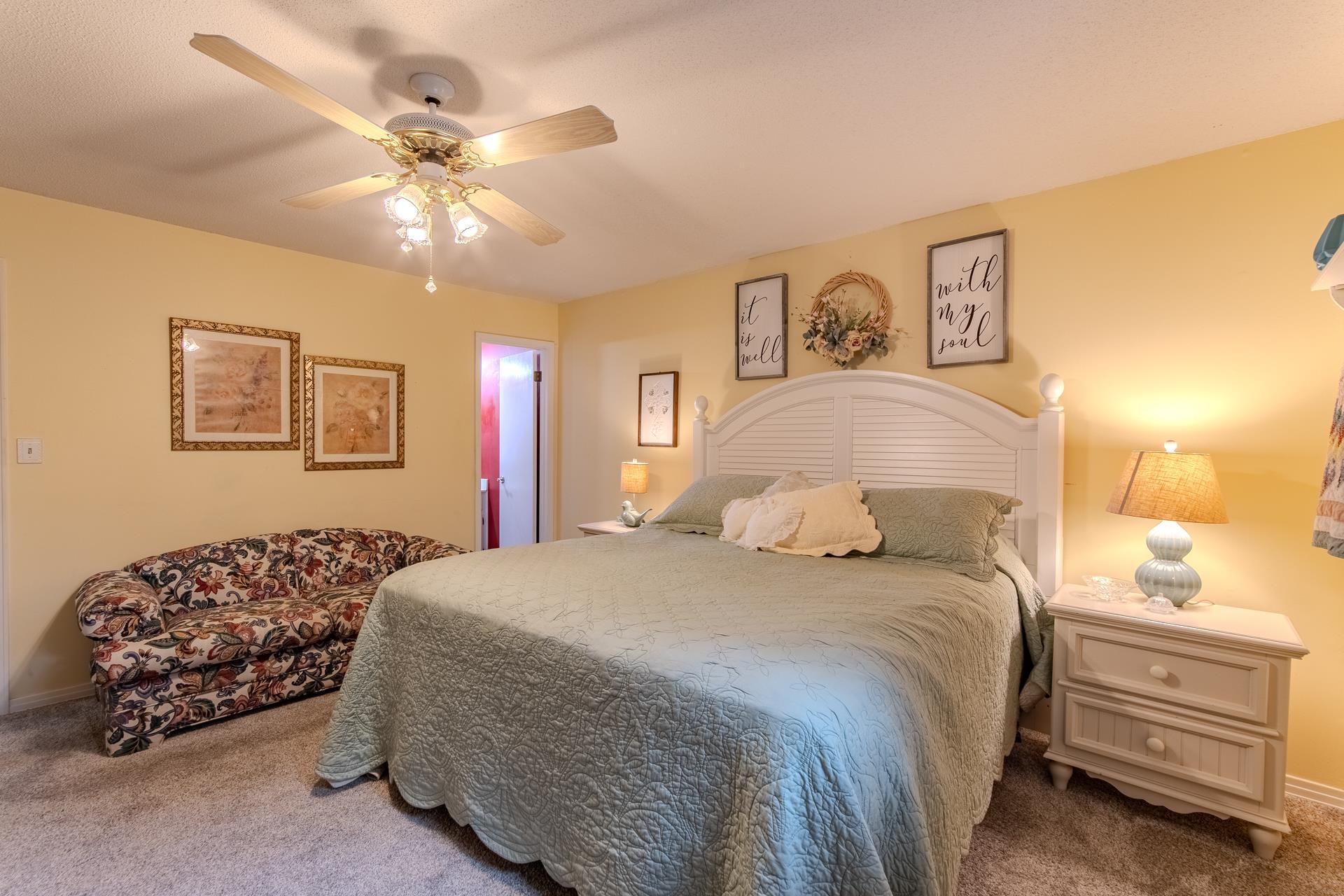 313 Country Club Lane Selmer, TN 38375 - Photo 25 of 36 a bedroom with a bed and a chandelier