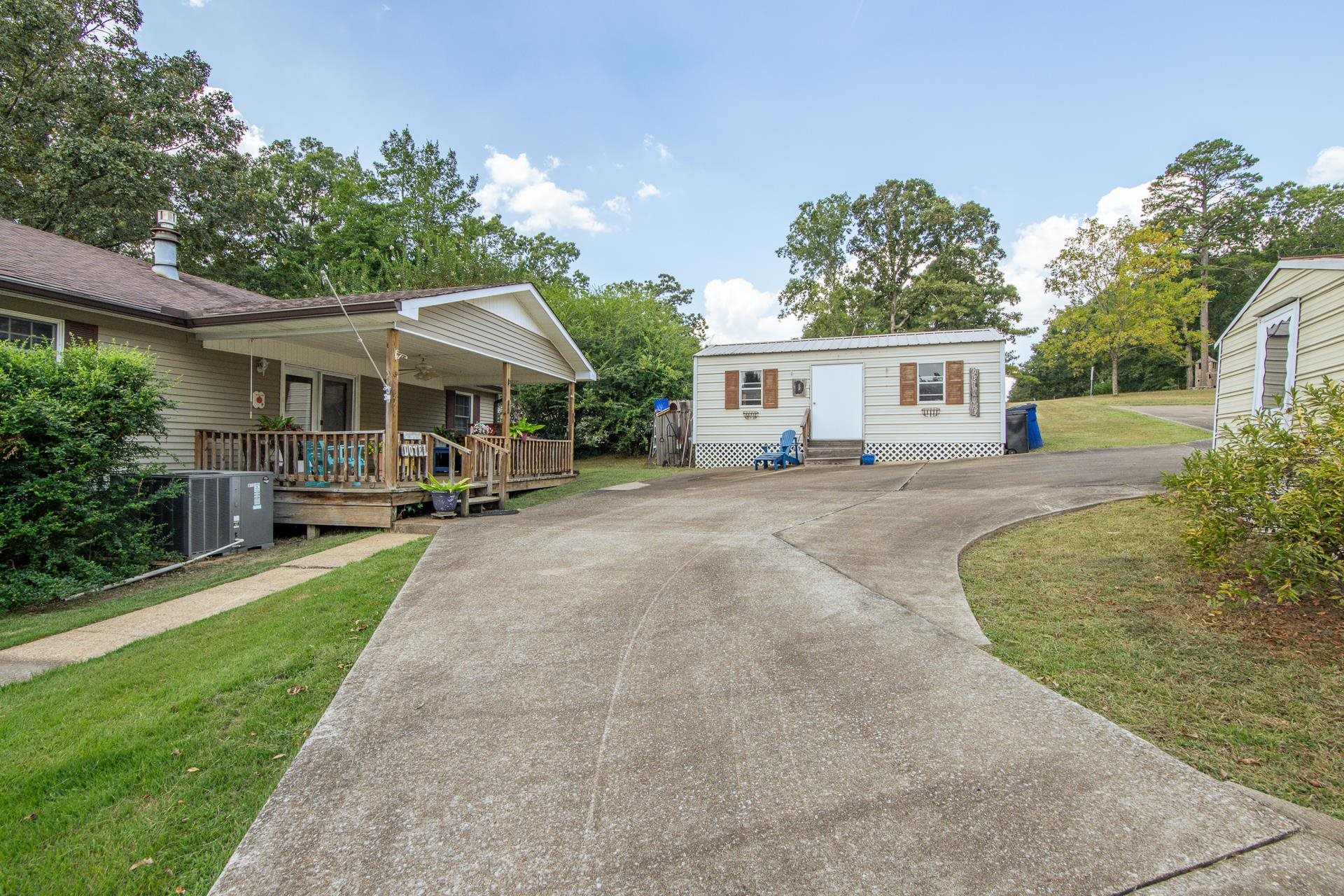 313 Country Club Lane Selmer, TN 38375 - Photo 29 of 36 a house view with a sitting space and garden
