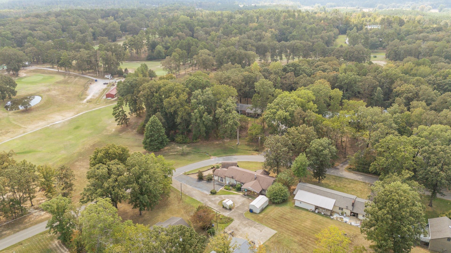 313 Country Club Lane Selmer, TN 38375 - Photo 32 of 36 an aerial view of a house with a yard