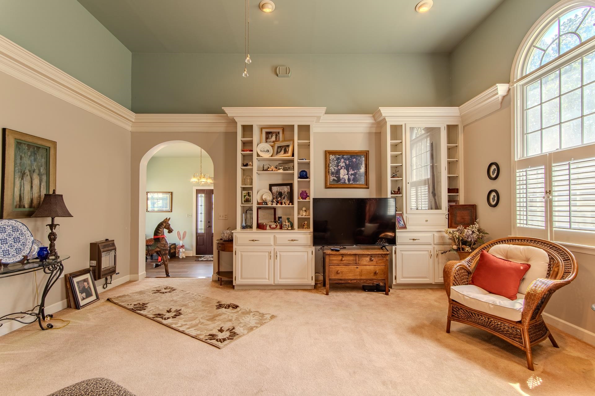 313 Country Club Lane Selmer, TN 38375 - Photo 7 of 36 a living room with furniture a flat screen tv and a table