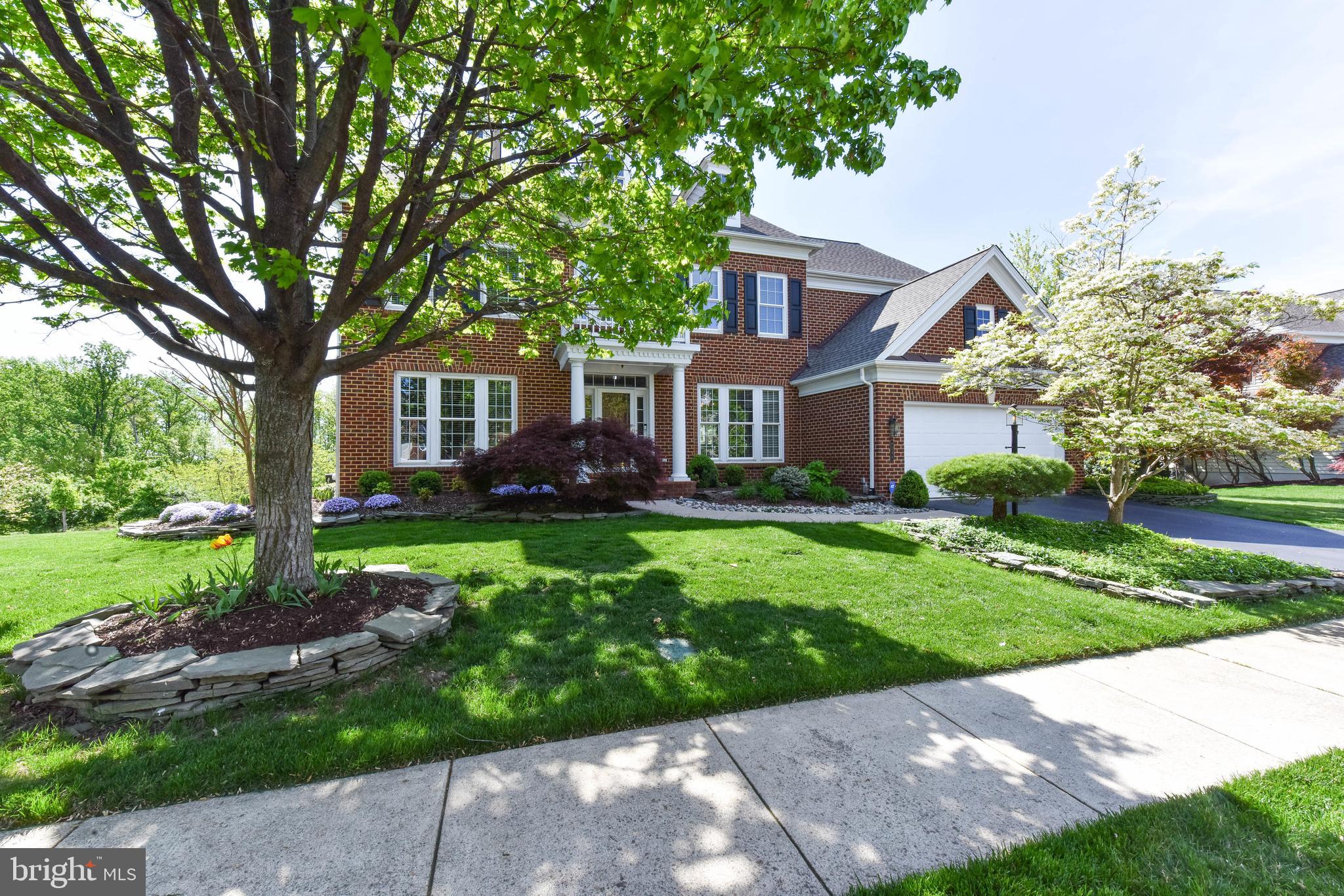 8244 Native Violet Drive Lorton, VA 22079 - Photo 11 of 68 a front view of a house with garden