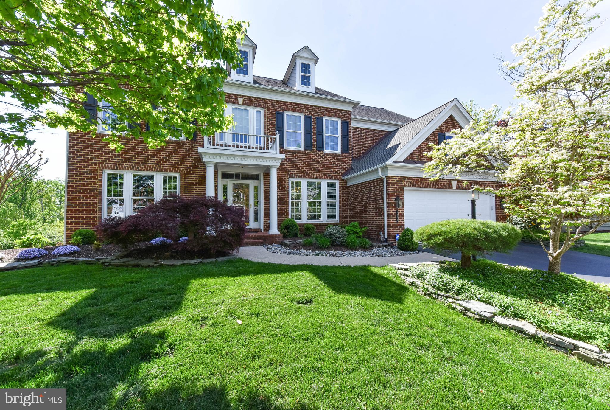 8244 Native Violet Drive Lorton, VA 22079 - Photo 12 of 68 a front view of a house with a garden
