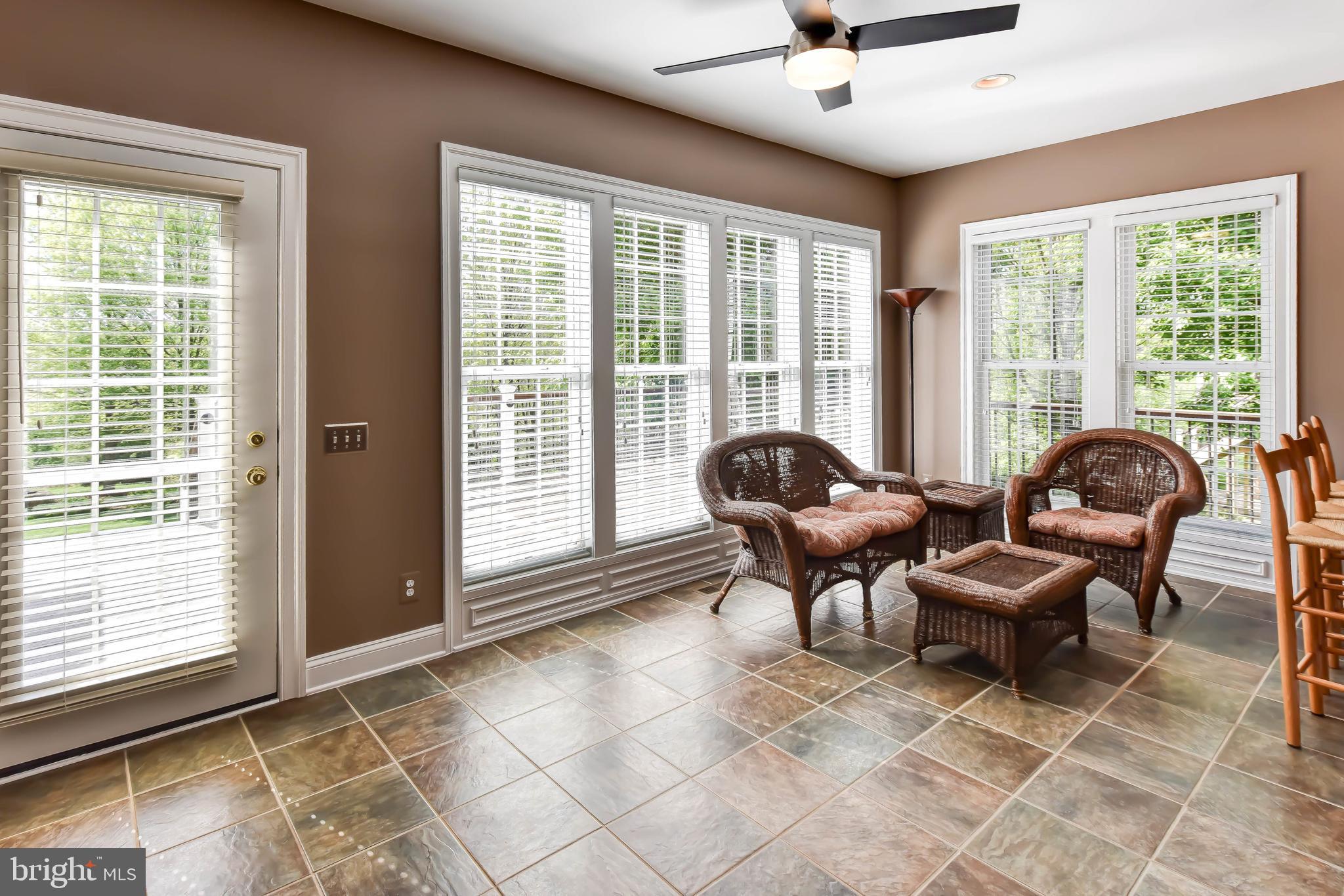 8244 Native Violet Drive Lorton, VA 22079 - Photo 24 of 68 a living room with furniture and floor to ceiling windows