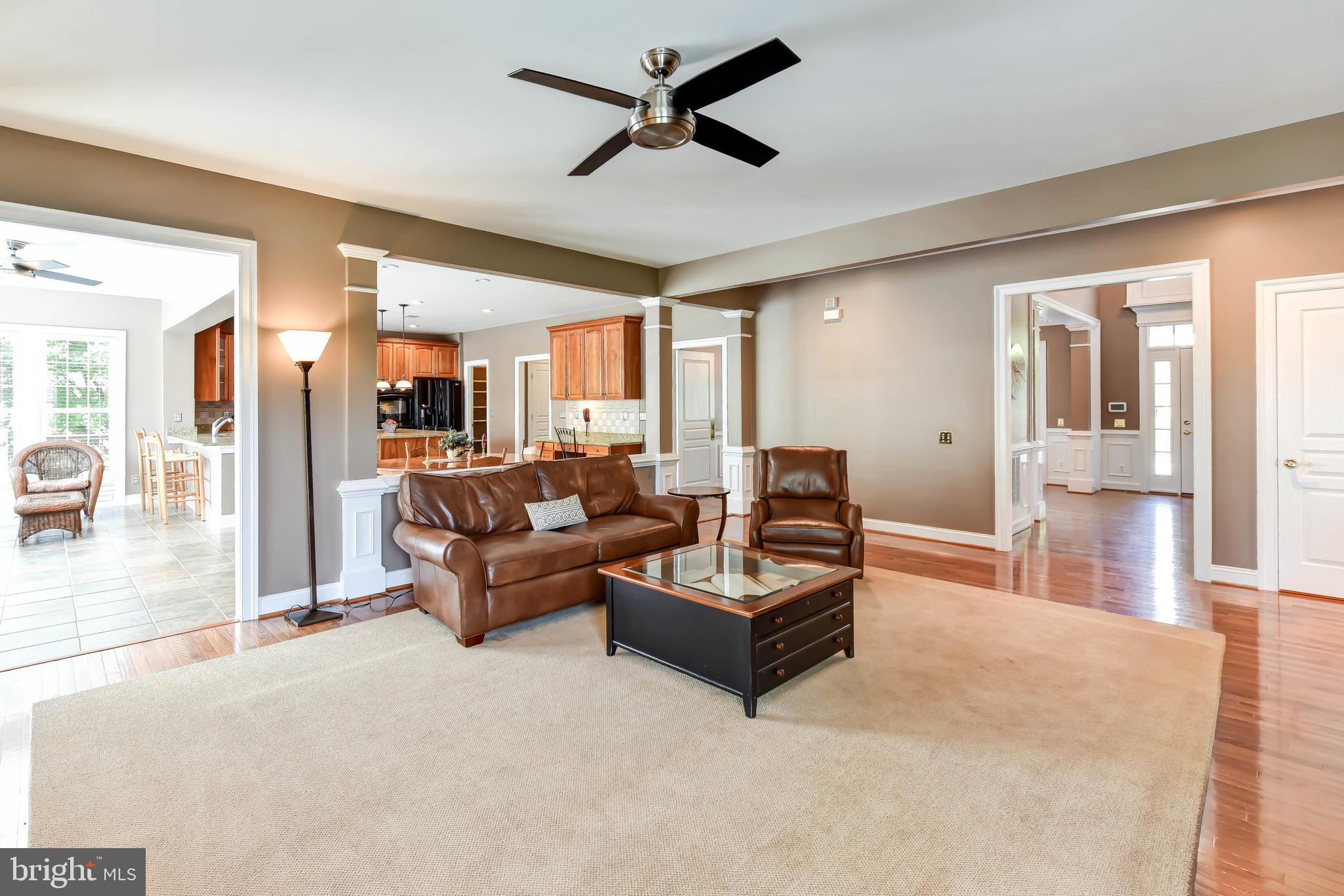 8244 Native Violet Drive Lorton, VA 22079 - Photo 26 of 68 a living room with furniture and a glass door