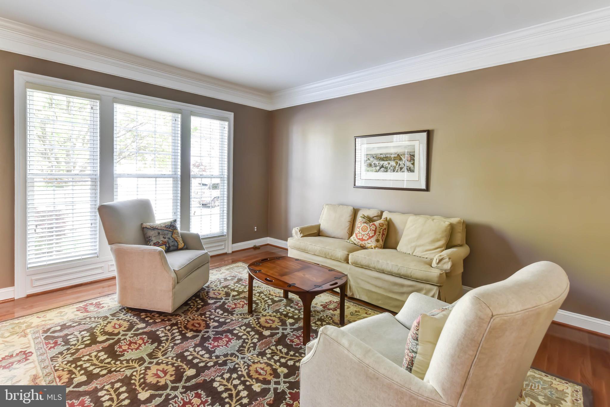 8244 Native Violet Drive Lorton, VA 22079 - Photo 28 of 68 a living room with furniture and large windows